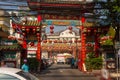 BANGKOK, THAILAND February 14, 2019: Traditional Chinese style temple, view from the street with asian passersby