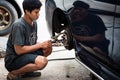 Checking car brake system for repair at car garage