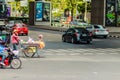 Bangkok, Thailand - February 22, 2017: Unidentified street hawker pushing a mobile kitchen cart during traffic jam in Bangkok, Th Royalty Free Stock Photo