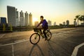 Bangkok thailand - february3,2019 : unidentifies man wearing clothes mask for protect dust riding bicycle in heart of bangkok