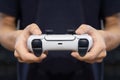 BANGKOK,THAILAND-FEBRUARY 6 ,View of Gamer Hands Playing the New Playstation 5 Console with DuelSense Wireless Controller on