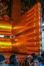 A feet of the Golden statue in Wat Pho, front view. Interior of the Temple of the Reclining Buddha. Famous sights of Bangkok.