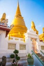 Bangkok, Thailand. Golden stupa on the background of blue sky. Royalty Free Stock Photo