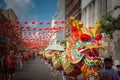 BANGKOK, THAILAND - JAN 25 2020: Group of people perform a traditional dragon dance parade at Chinatown to celebrate traditional C Royalty Free Stock Photo