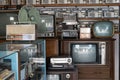 Old vintage different radios, television and electronic in antique store shelves at Bang Yai Nonthaburi, Thailand.