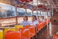 people in early morning go by boat at the bangkok river to work. The ferry belongs to public transportation in Bangkok