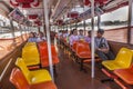 people in early morning go by boat at the bangkok river to work. The ferry belongs to public transportation in Bangkok