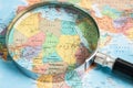 Bangkok, Thailand January 20, 2022 Africe, Magnifying glass close up with colorful world map, travel, geography, tourism and Royalty Free Stock Photo