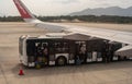 Bangkok, Thailand, 24 January 2024: Boarding process at airport, passengers exiting shuttle bus, proceeding to board aircraft Royalty Free Stock Photo