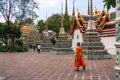 Bangkok, Thailand - January 26, 2018: Buddhist walking in Wat Pho (the Temple of the Reclining Buddha), Bangkok Thailand
