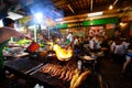 Bangkok, Thailand - January 26, 2019 : Chef prepares food at street side restaurant in Chinatown