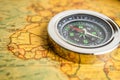 Bangkok, Thailand - January 20, 2022 Compass for navigation on vintage old antique world map background to travel, geography, Royalty Free Stock Photo