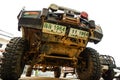 BANGKOK, THAILAND - JANUARY 14, 2018: Front view of bigfoot car is stain of muddy soil, parked in the village