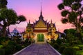 Giant statue at white pagoda in Wat Arun Ratchawararam Ratchawaramahawihan in sunset time Royalty Free Stock Photo