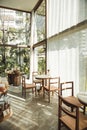 BANGKOK, THAILAND - JANUARY 22, 2017: A glass house near green t Royalty Free Stock Photo