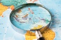 Bangkok, Thailand January 20, 2022 Indonesia, Magnifying glass close up with colorful world map, travel, geography, tourism and