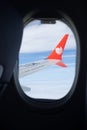 Bangkok, Thailand - January 3, 2019: Indonesian low-cost airline, Lion Air Logo on flying plane wing from passenger window seat