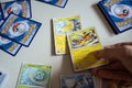 A man playing Pokemon Trading Card game.