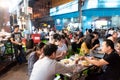 Bangkok, Thailand, January 12, 2018: Many people eating street food on the lively Yarowat Road, also known as Chinatown