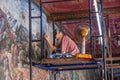 mural art painter renovates the painted wall in the grand Palace, Bangkok Royalty Free Stock Photo