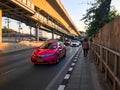 Bangkok, Thailand - January 04 2020: Pink taxi and Peaple is walking on walkway at Sukhumvit road and Bangkok skytrain BTS at