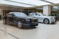 Bangkok, Thailand, January 5, 2020: rolls Royce Executive business sedan and blue supercar, a pair of new ones in the dealership,
