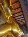 Bangkok, Thailand - January 1st 2020: Sleeping Buddha statue gold face. Reclining Buddha. Wat Pho, Bangkok, Thailand. Royalty Free Stock Photo