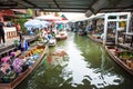 Bangkok, Thailand, January 27 2018: Tourists on a boat at the floating market at suburb side of Bangkok. Long tail boat for touris