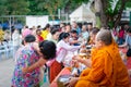 Thai monk ask for alms for buddhist to make merit Royalty Free Stock Photo