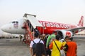 Bangkok, Thailand - January 30, 2019 : Unidentified tourists going up to the plane with Thai airasia at Don muang airport