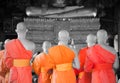 BANGKOK, THAILAND -11 JUL 2014 thai monks stand in the hall for