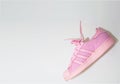 Bangkok,Thailand,July 2,2021-adidas pink sneakers shoes with shoelace on wall side view soft focus