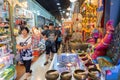 Bangkok, Thailand - July 28, 2019: Asian travelers pass by a souvenir shop at Asiatique The Riverfront