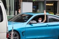 `Car Mob` Protesters a three finger salute to show symbolic gestures between driving vehicles and honk.