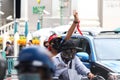 `Car Mob` Protesters a three finger salute to show symbolic gestures between driving vehicles and honk.