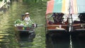 BANGKOK, THAILAND - 13 JULY 2019: Lat Mayom floating market. Traditional classic khlong river canal, local women farmers, long-