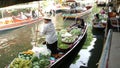 BANGKOK, THAILAND - 13 JULY 2019: Lat Mayom floating market. Traditional classic khlong river canal, local women farmers, long-