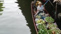 BANGKOK, THAILAND - 13 JULY 2019: Lat Mayom floating market. Traditional classic khlong river canal, local women farmers, long-