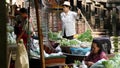 BANGKOK, THAILAND - 13 JULY 2019: Lat Mayom floating market. Traditional classic khlong river canal, local women farmers, long- Royalty Free Stock Photo