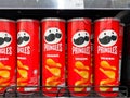 Many flavors of Pringles potato chip on shelf on 7-11