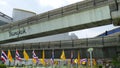 BANGKOK, THAILAND - 11 JULY, 2019: Pedestrians walking on the bridge near MBK and Siam Square under BTS train line. People in