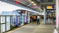 Peoples at Bangkok skytrain BTS or The Metropolitan Rapid Transit MRT at Tao Poon Station. People are wearing surgical mask fr Royalty Free Stock Photo