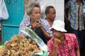 Vegetable vendors at Pak Khlong Talat market waiting for business, Bangkok, Thailand