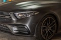 Close-up of Headlights, Wheel, and Rim of Matte black mercedes sports car