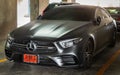 Front view shot of Matte black mercedes sports car parked in the parking lot