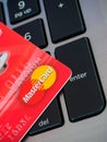 Bangkok, Thailand - Jun 23, 2016 red Credit card with MasterCard logo on computer keyboard Royalty Free Stock Photo