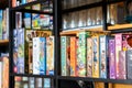 Bangkok, Thailand - Jun 06, 2018 : Several type of colourful board game boxs on the shelves of games cafe for customer to play or