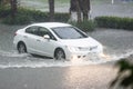 Car driving flood water, it`s raining heavily hard, Some of the flooded Royalty Free Stock Photo