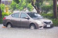 Bangkok Thailand :- June 5, 2017 : Car driving flood water, it`s raining heavily hard, Some of the flooded area is flooded up unt Royalty Free Stock Photo