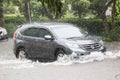 Car driving flood water, it`s raining heavily hard, Some of the flooded area is flooded Royalty Free Stock Photo